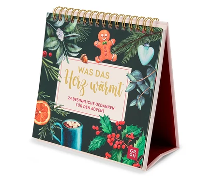 Vue d'un calendrier de table sur le thème de Noël, comprenant un bonhomme en pain d'épice et une tasse de boisson chaude.