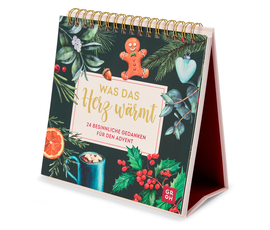 Vue d'un calendrier de table sur le thème de Noël, comprenant un bonhomme en pain d'épice et une tasse de boisson chaude.