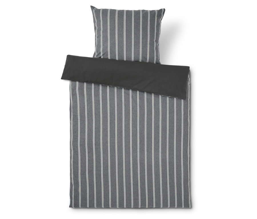 Linge de lit et oreiller à rayures grises.