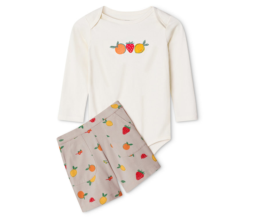 Ensemble pour bébé : body et short. Body blanc à manches longues avec broderie de fruits et short beige à motif de fruits.