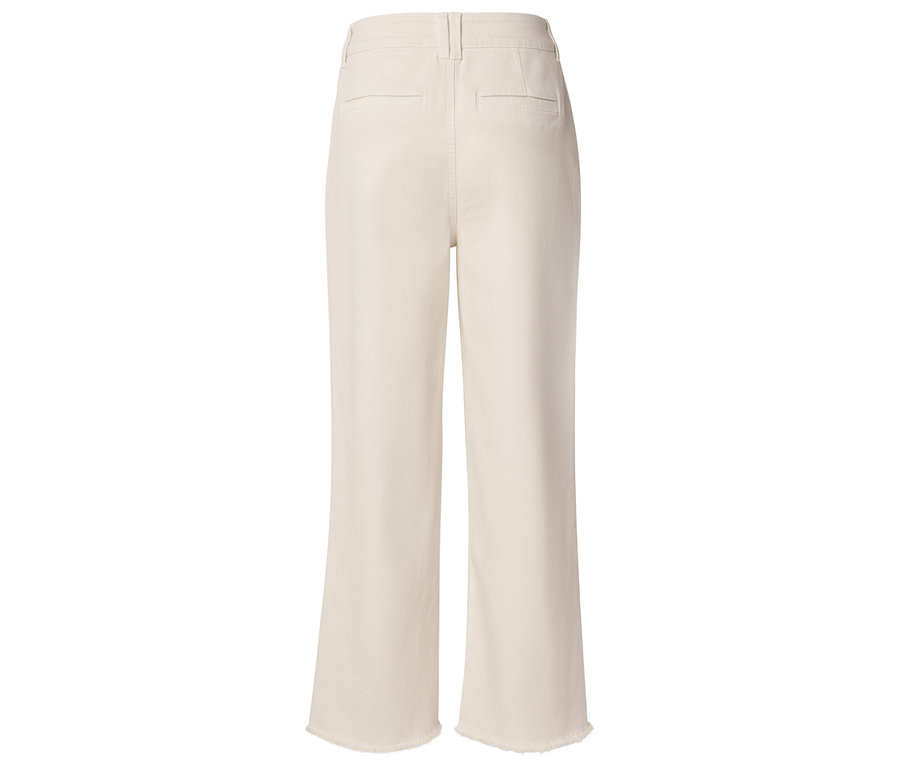 Vue arrière d'un pantalon crème ample avec des franges au bas des jambes.