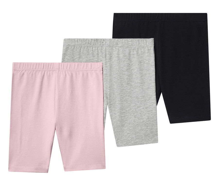 Trois leggings courts rose, gris et noir sont superposés.