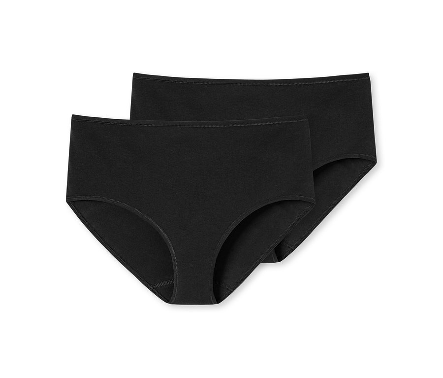 Deux culottes noires, l'une légèrement derrière l'autre.