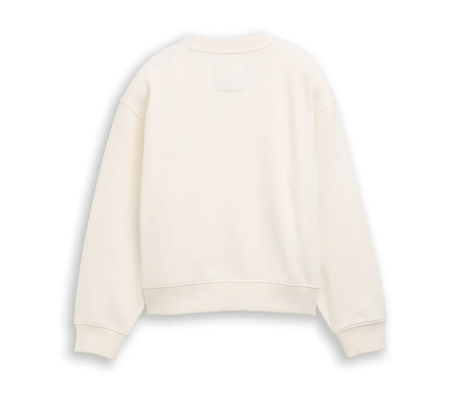 Sweat-shirt crème vu de dos, avec des poignets et un ourlet côtelés, et une petite étiquette au niveau de la nuque.