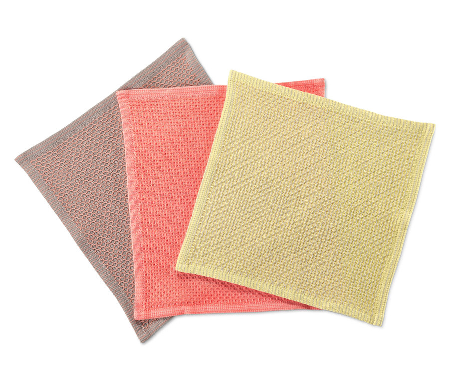 Trois lavettes en gris, rose et jaune.