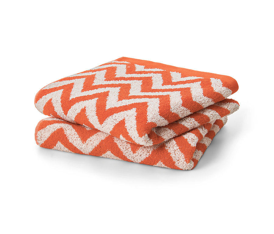 Deux torchons en jacquard orange pliés l’un sur l’autre.