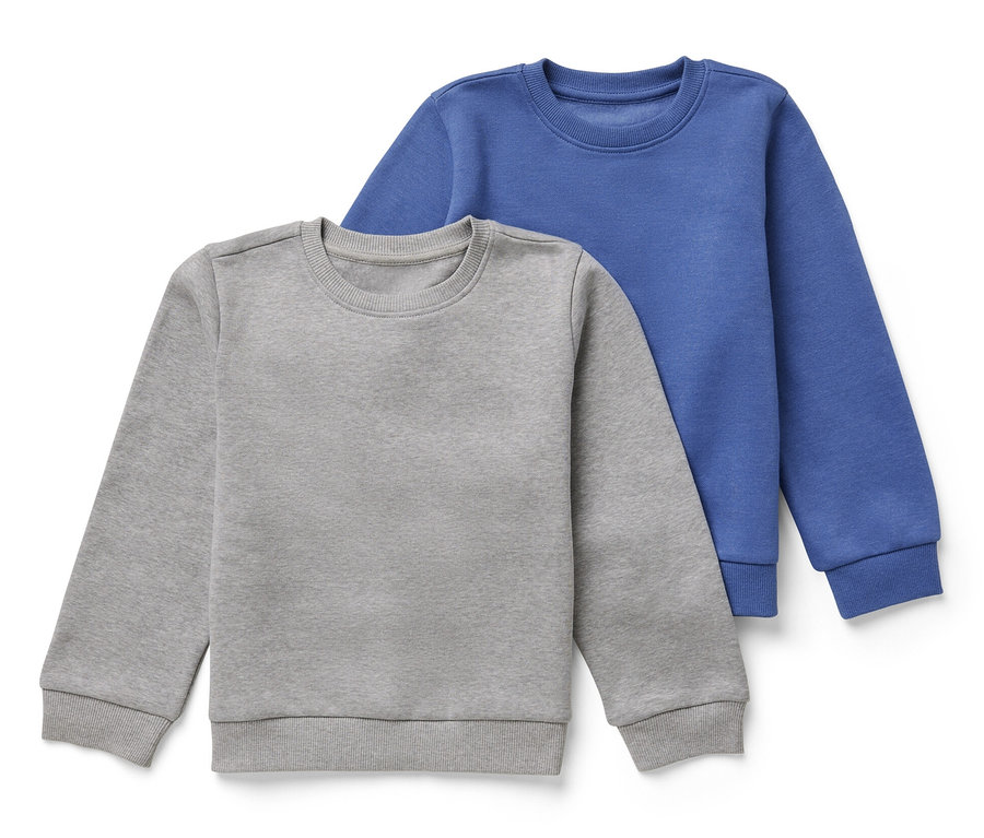 Deux sweatshirts pour enfant avec intérieur gratté, un gris et un bleu, sont posés l'un sur l'autre.