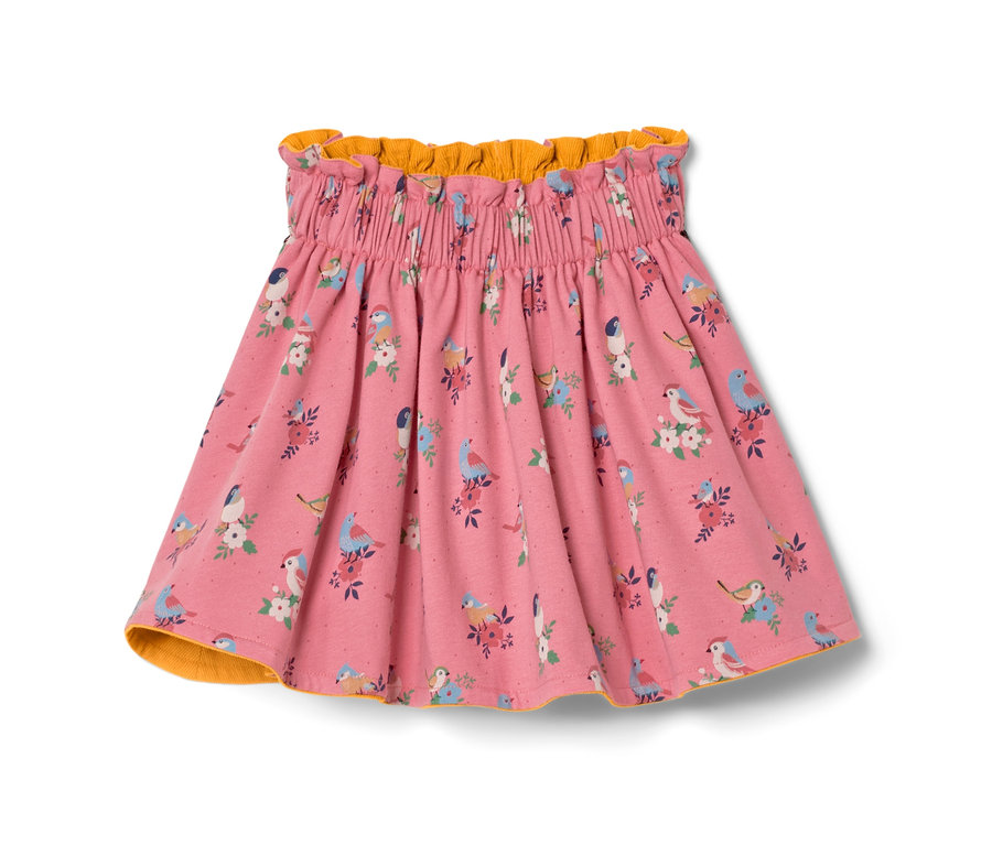Jupe réversible en velours rose pour tout-petit avec motif d'oiseaux et de fleurs.