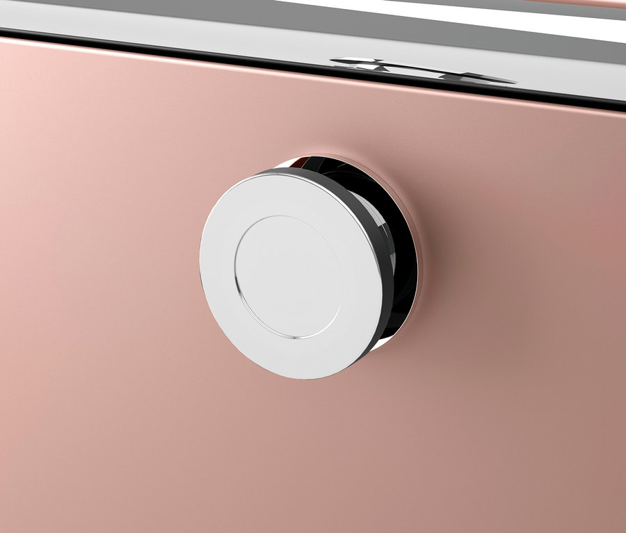 Gros plan d'un appareil rose avec un bouton chromé.