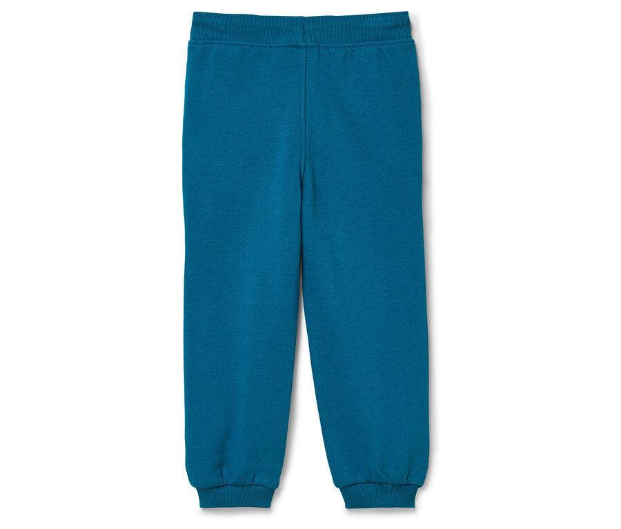 Pantalon de survêtement bleu sur fond blanc.