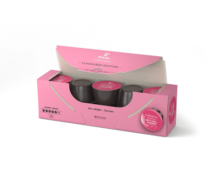 Boîte rose ouverte de Cafissimo Flavoured Espresso – White Choc & Raspberry avec dix capsules à l'intérieur.