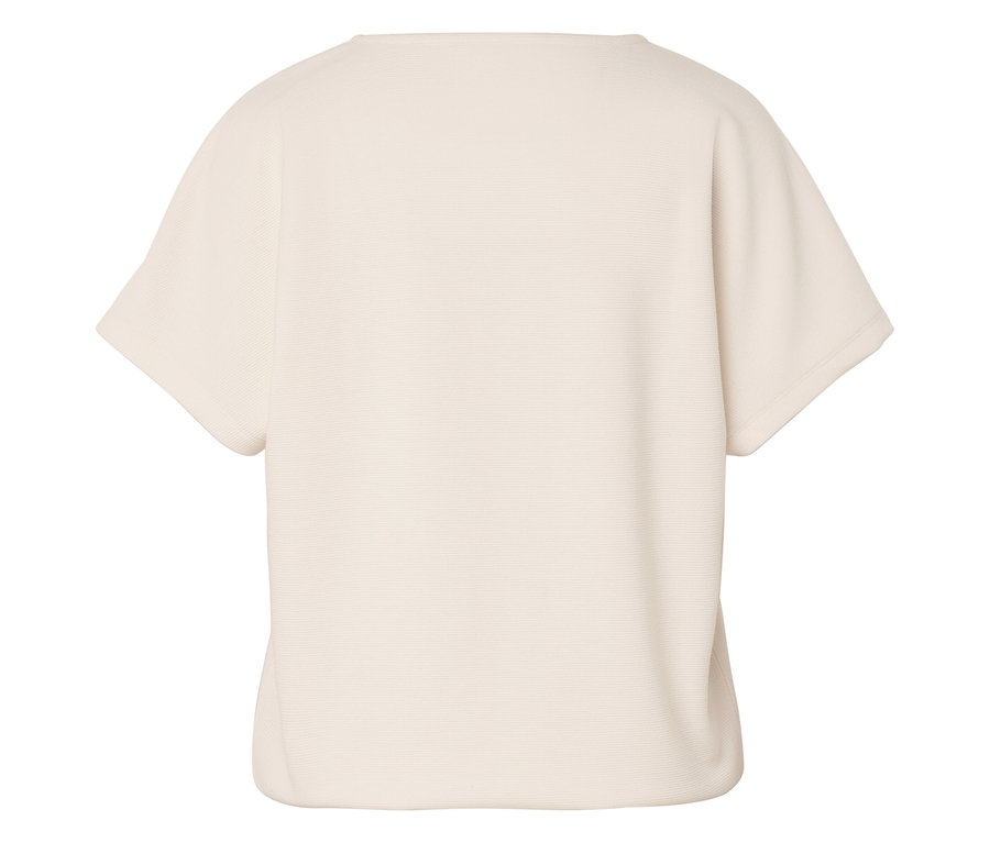 Gros plan d'un t-shirt ivoire à manches courtes.