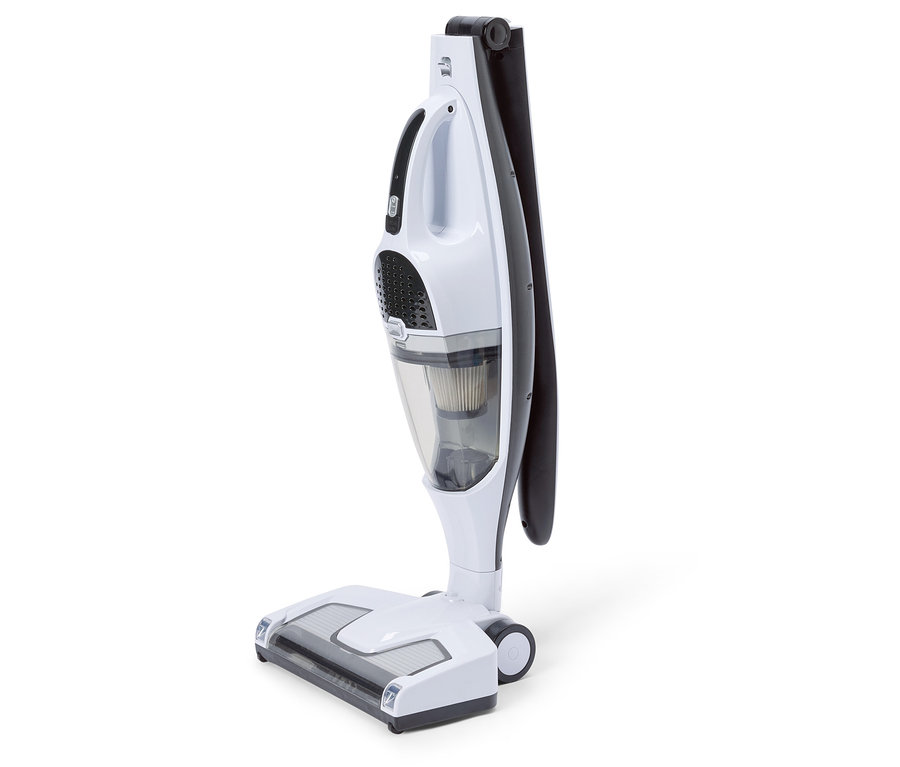 Un aspirateur blanc et noir se dresse sur un fond blanc.