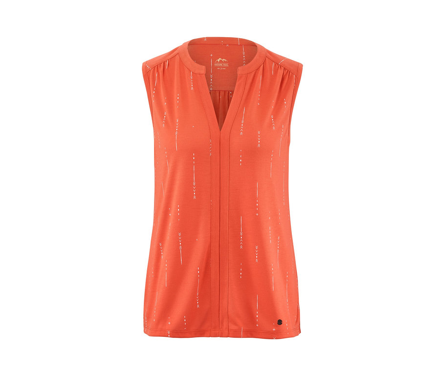 Top fonctionnel orange avec imprimé blanc.