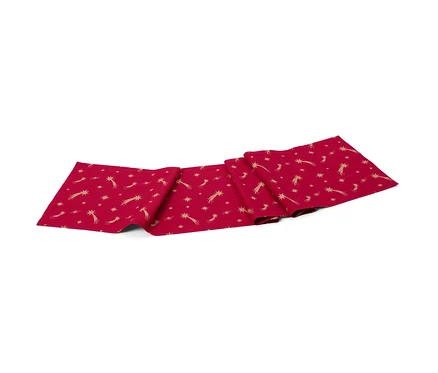 Un chemin de table en coton rouge avec des étoiles dorées et des comètes.