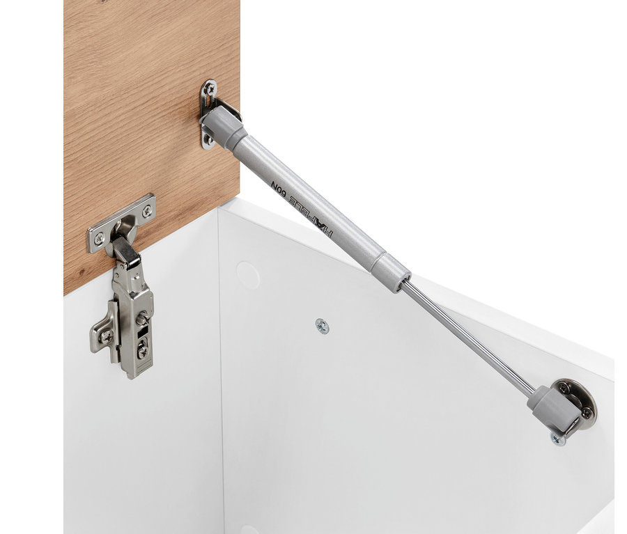 Détail d'un banc de lit ouvert avec fonction coffre, vue sur le mécanisme d'ouverture.