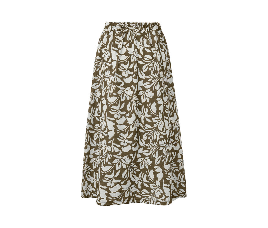 Une jupe midi imprimée avec un motif de feuilles blanches sur fond marron.