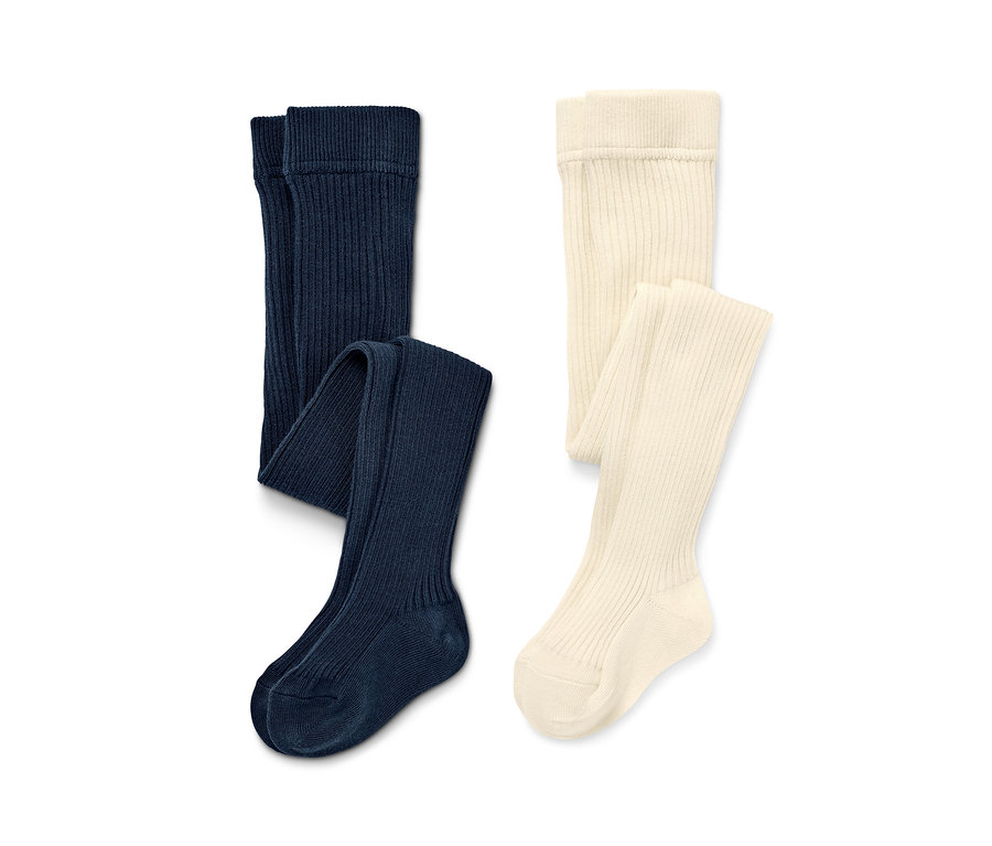Deux paires de collants enfant unies : bleu marine et crème.