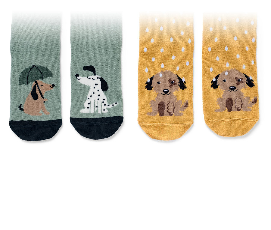 Deux paires de chaussettes anti-dérapantes pour enfant avec motifs de chiens.