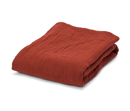 Serviette outdoor en mousseline pliée.