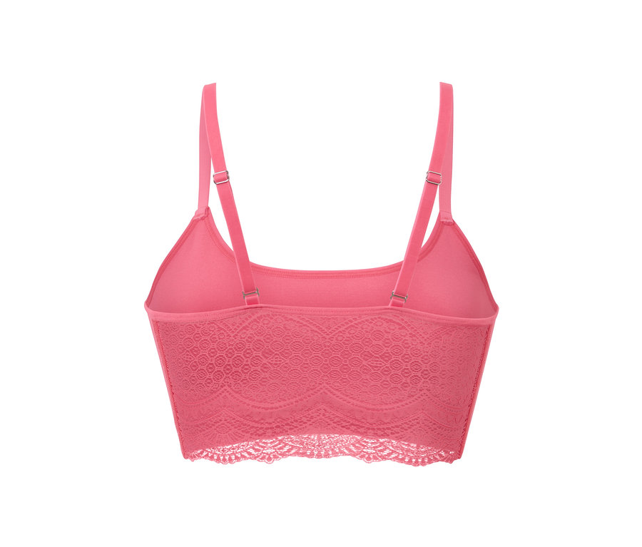 Vue détaillée de dos d'une brassière sans coutures rose vif avec de la dentelle.