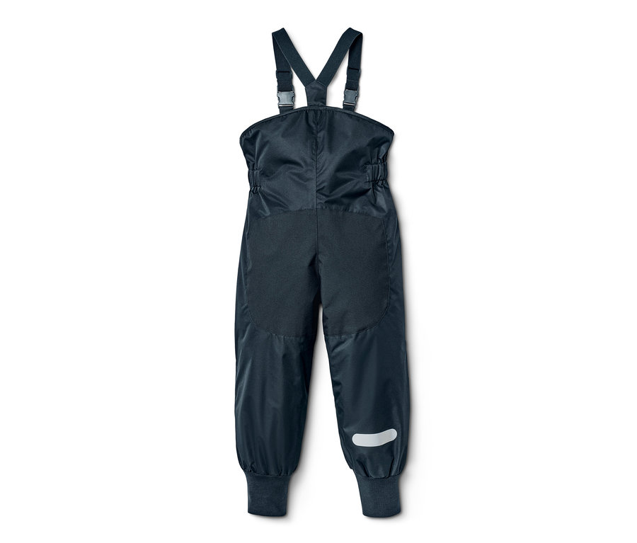 Pantalon de pluie évolutif pour enfant bleu marine avec bavette et bande réfléchissante sur la jambe.