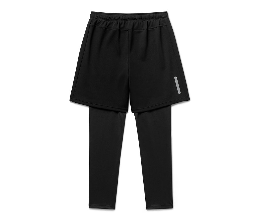 Un tight de sport noir pour enfant avec un short sur fond blanc.