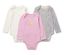 Trois bodies pour bébé avec fonction évolutive : un blanc, un rose avec un poussin, un à fleurs.