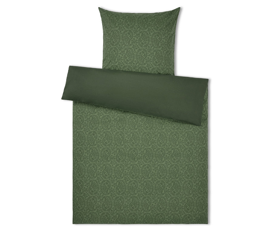 Linge de lit vert avec motif de feuilles et oreiller vert.