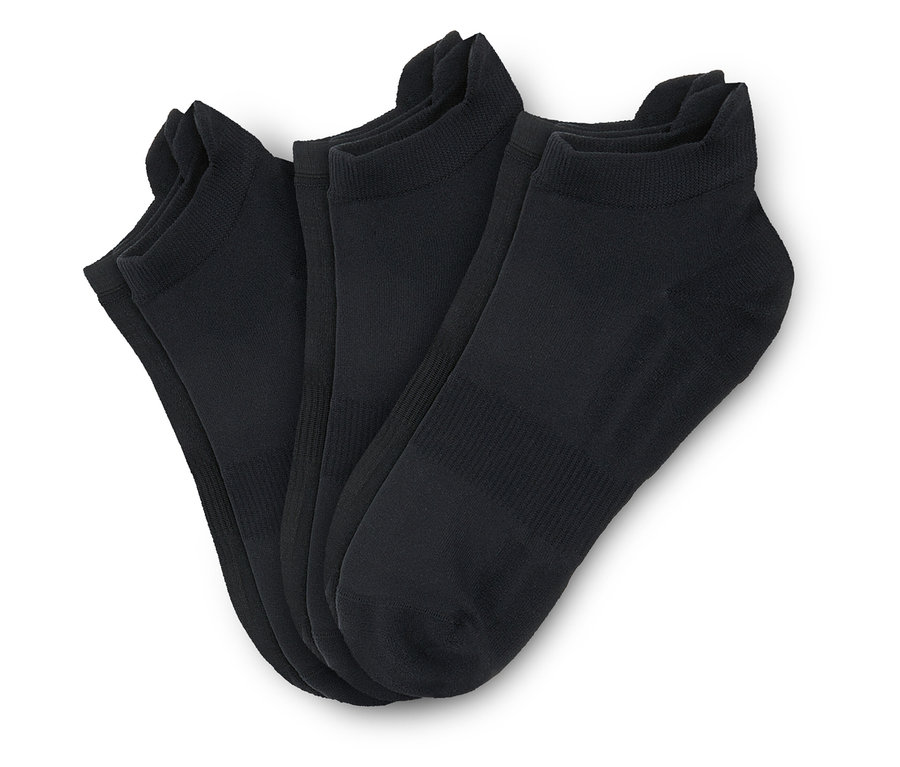 Trois paires de chaussettes de course professionnelles noires.