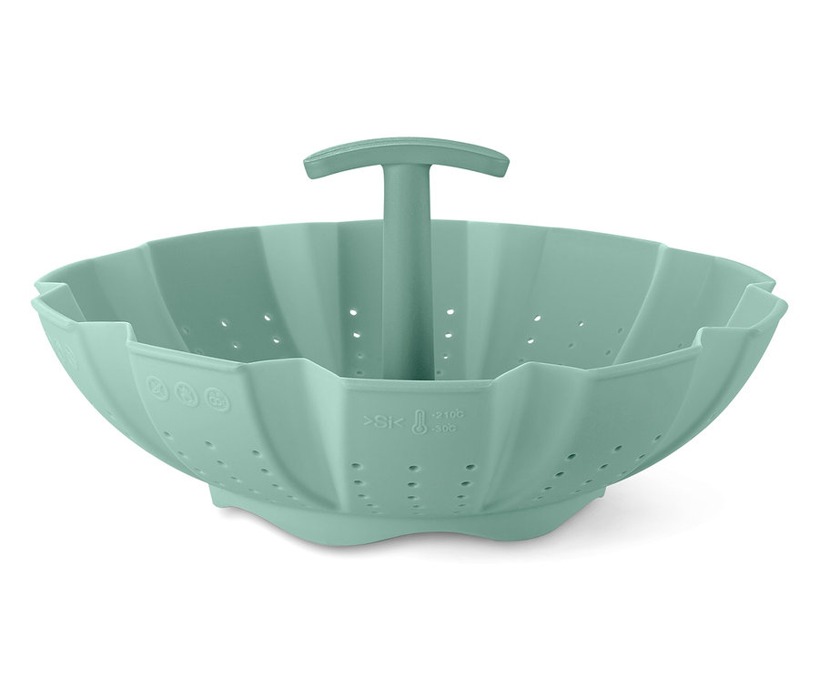 Un panier vapeur en silicone vert avec une poignée au centre.