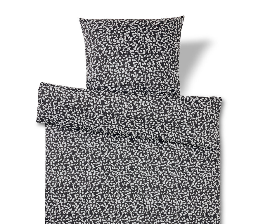 Ensemble de literie noir et blanc à motif floral.