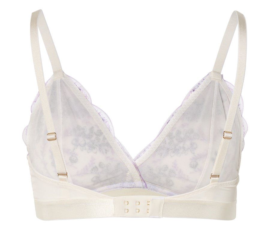 Vue de dessus d'un soutien-gorge blanc avec bretelles réglables et motif floral.