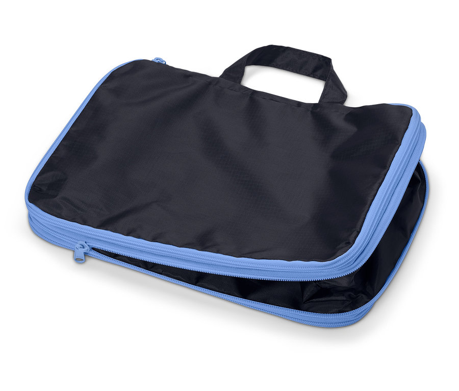 Sac de voyage rectangulaire noir avec fermeture éclair bleu clair et poignée, partiellement ouvert.