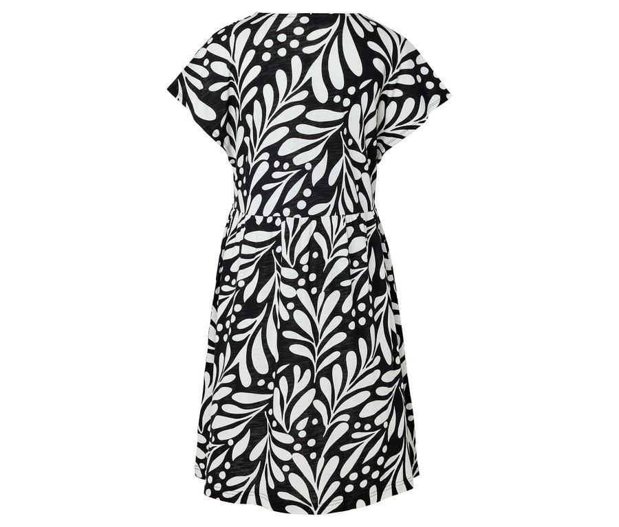 Robe noire avec motif de feuilles blanches.