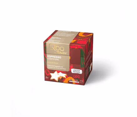Paquet de 8 capsules d'espresso Qbo ES Zimtstern rouge et or, avec des biscuits en forme d'étoile et l'inscription "Limited Edition".