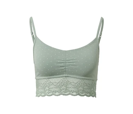 Brassière verte à pois blancs avec bordure en dentelle.