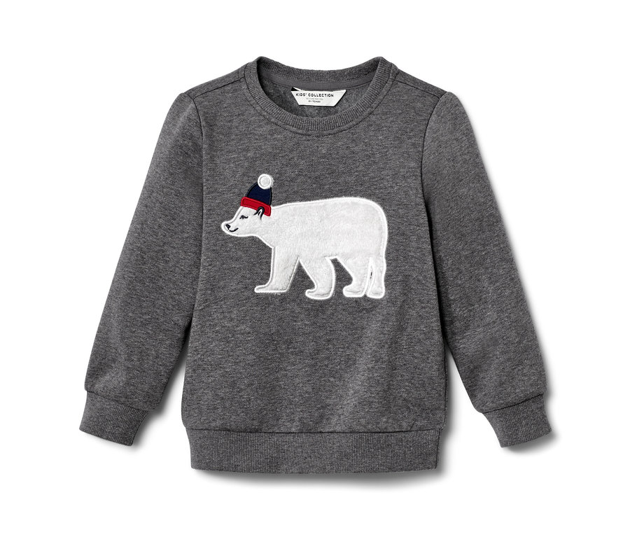 Sweatshirt enfant gris avec un patch d'ours polaire portant un bonnet rouge.