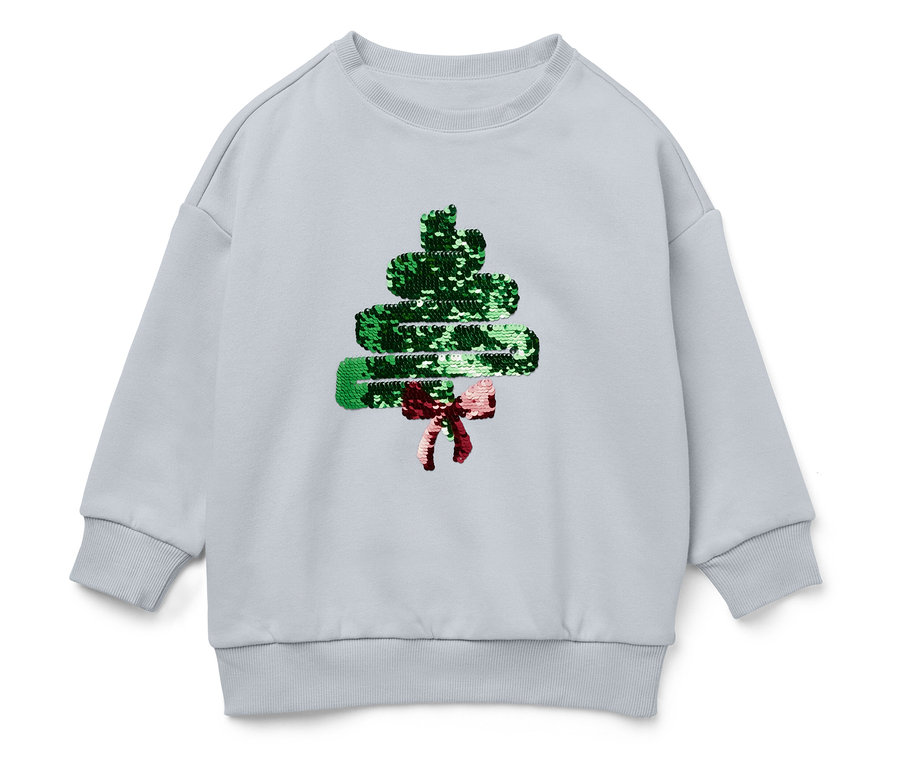 Pull bleu clair avec un sapin de Noël à paillettes et un nœud rouge.