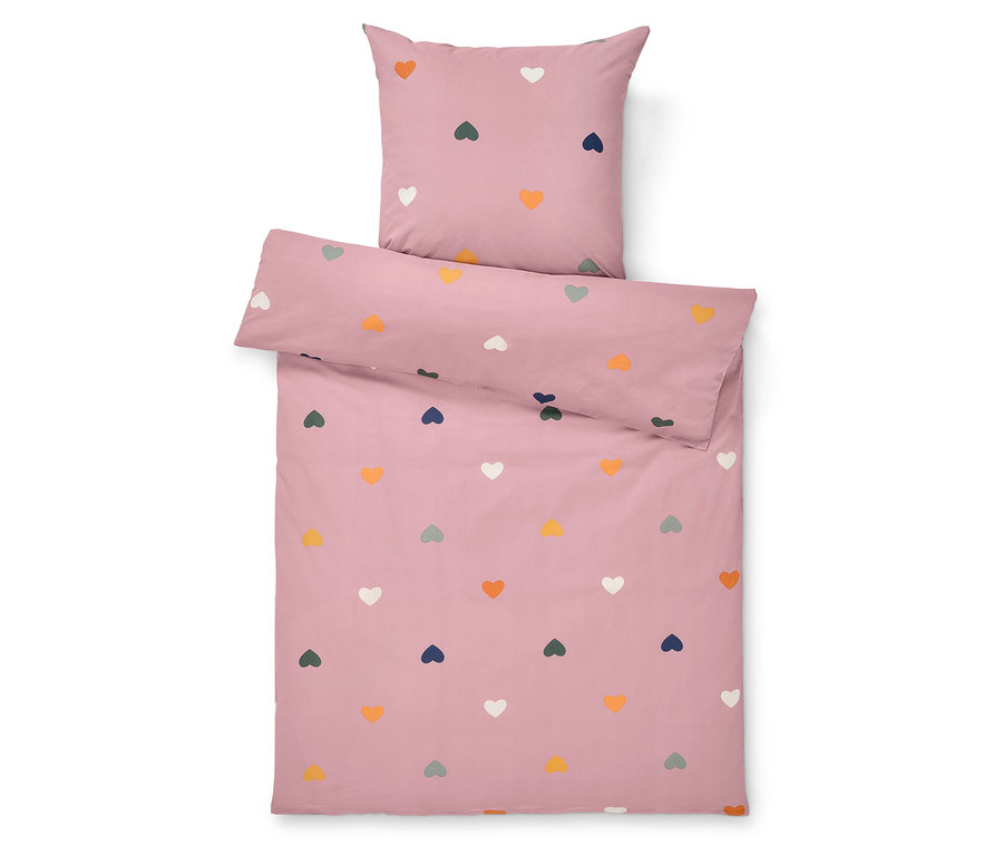 Linge de lit rose avec des coeurs colorés.