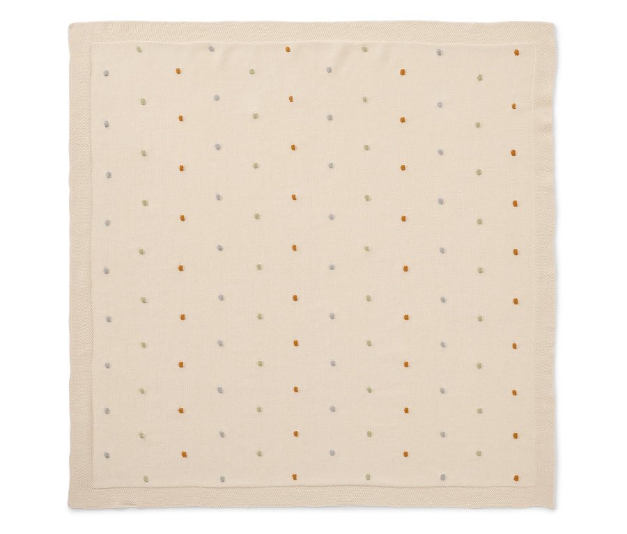 Couverture bébé couleur crème avec petits points colorés.