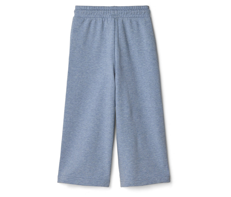 Pantalon de jogging bleu clair à jambes larges avec taille élastique, posé à plat sur un fond blanc.