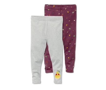Deux leggings : un gris avec un motif de poire et un violet avec un motif de légumes.
