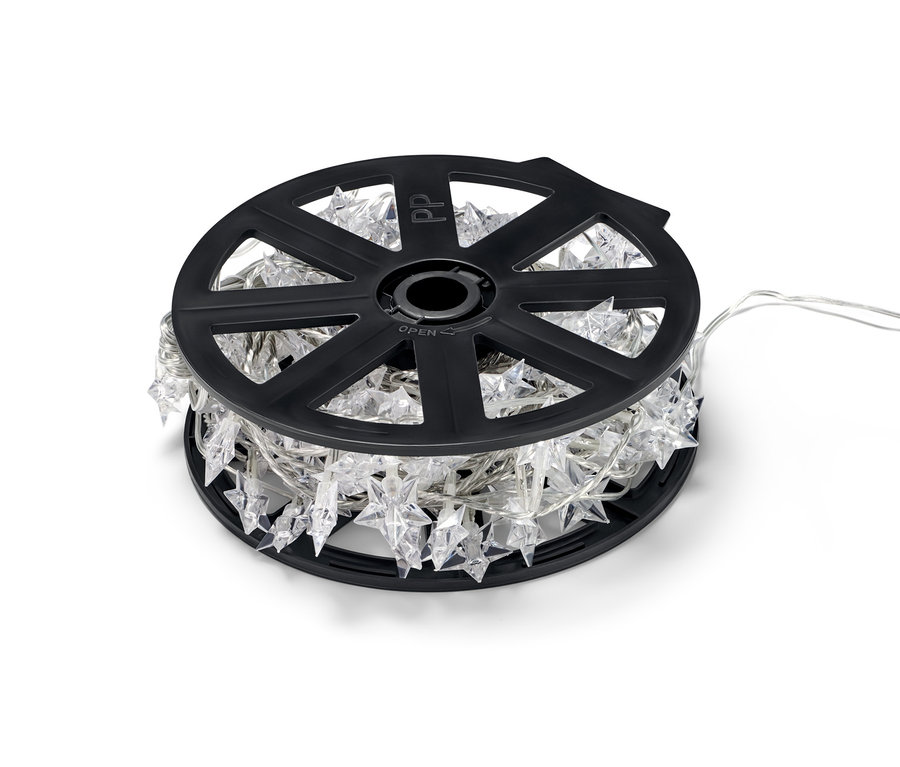 Une guirlande lumineuse d'extérieur à LED avec des étoiles enroulée sur un support en plastique noir.