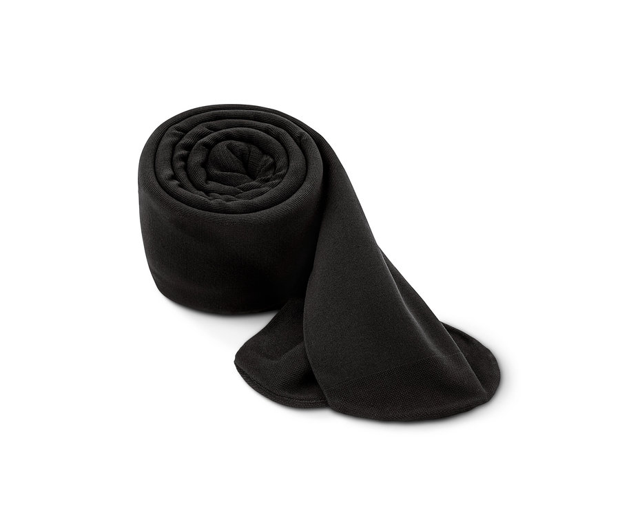 Un collant thermique noir enroulé en spirale sur fond blanc.