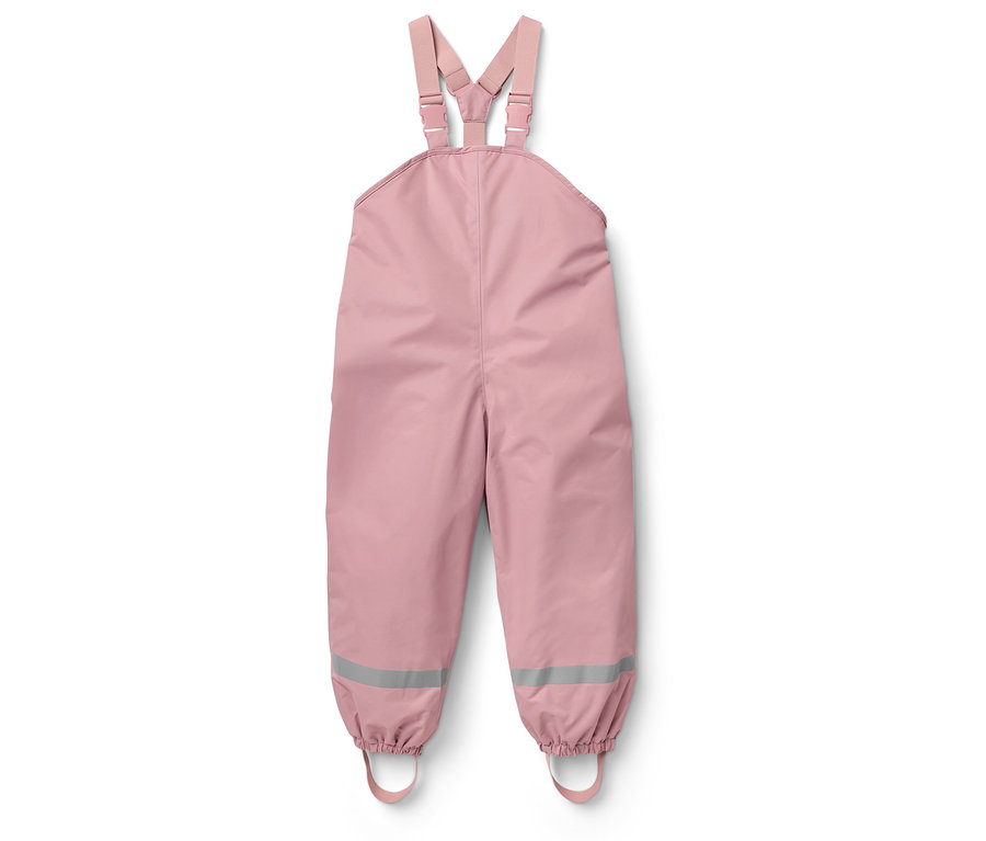 Salopette rose avec des réflecteurs sur les jambes.