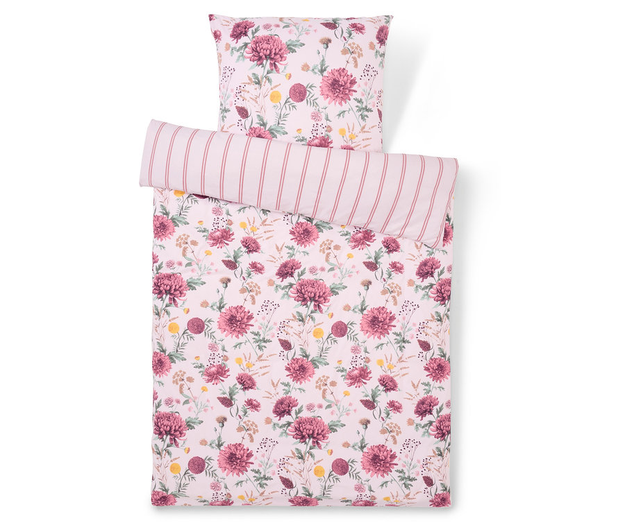 Linge de lit à motif floral avec oreiller rayé.