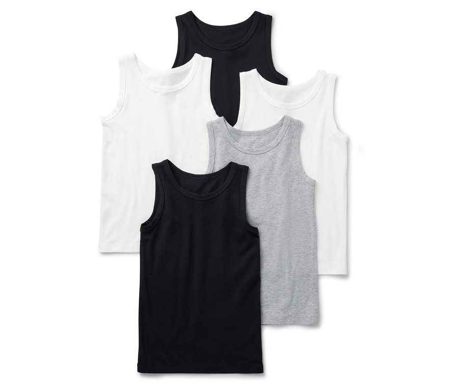 Six débardeurs en noir, blanc et gris sont posés les uns sur les autres.