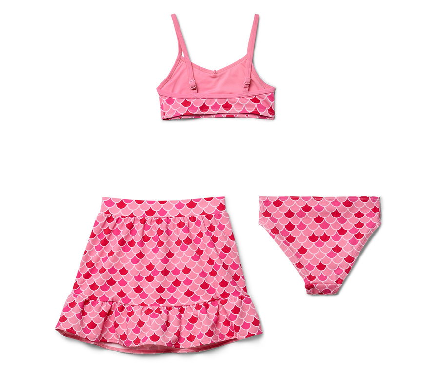 Ensemble de maillot de bain rose à motif d'écailles de poisson comprenant un haut, une culotte de bain et une jupe.