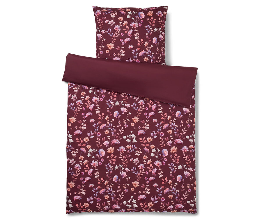 Vue de dessus d'un ensemble de literie bordeaux à motif floral, composé d'une taie d'oreiller, d'une couette et d'un drap.